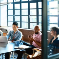 people sitting and working in a cafe